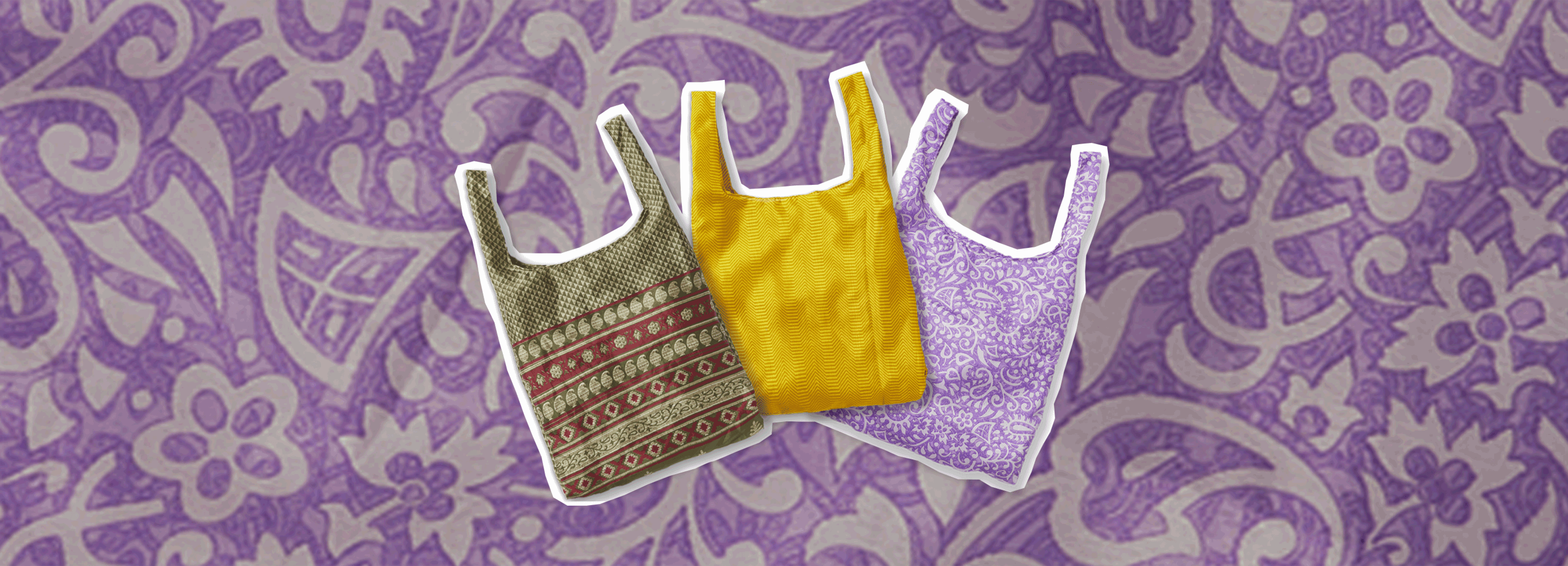 Drei Tragetaschen aus buntem Stoff