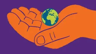 Illustration: Eine Hand hält einen Miniatur-Erdball